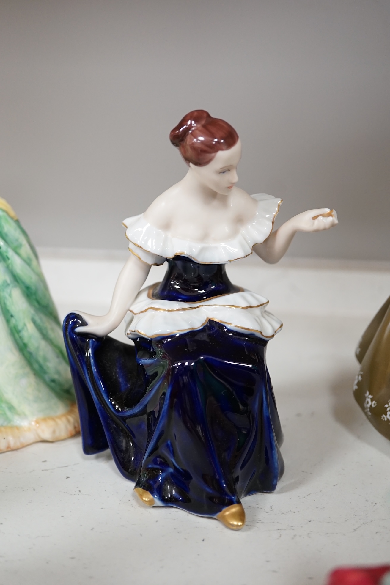 Seven Royal Doulton and Royal Dux female figures, including Fair Lady, Secret Thoughts, Valerie, Home Again, etc. Condition - good.